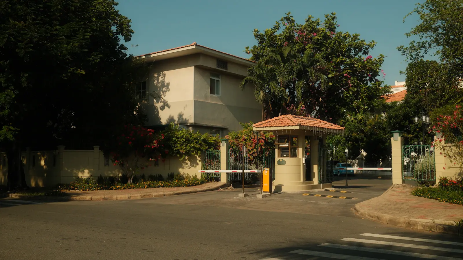 Guard booth and vehicle gates at the entrance to a residential community